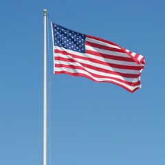 Obraz premium Patriotic American Flag Waving Proudly in Clear Blue Sky.