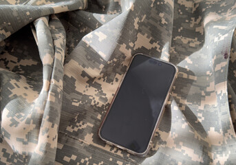 Blank mobile phone on military equipment, template for SMS, Ukrainian Armed Forces