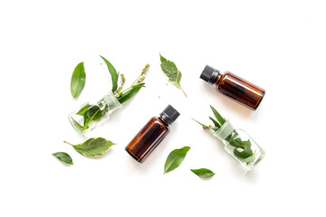 Herbal cosmetics with essential oils of medicinal fresh herbs, top view
