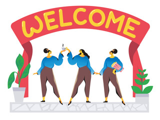 Women stanidng under welcome banner