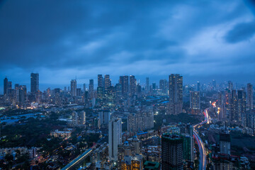 Monsoon Twilight in Midtown Mumbai - View from Byculla with city lights and cloudy blue skies.
