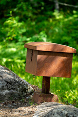 rusty steel box in the forest of the Romsdalseggen trail in Andalsnes Norway