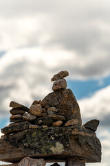 Norwegian DNT  trail marker on a stone in Andalsnes on the romsdalseggen trail with mountain in the background in summer