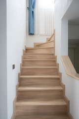  A modern, light-toned wooden staircase inside a contemporary home