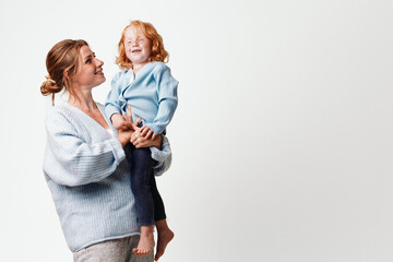 Mother and daughter bonding moment in flight on a white background for family travel and joyful moments collection
