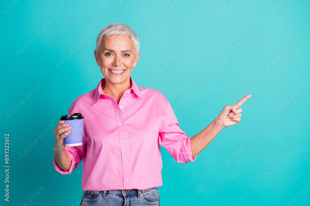 Canvas Prints Photo of pretty aged woman coffee point finger empty space wear pink shirt isolated on teal color background