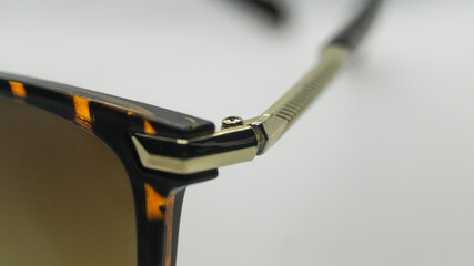 Eyeglass bracket attachment. The screw connects the glasses and the frame