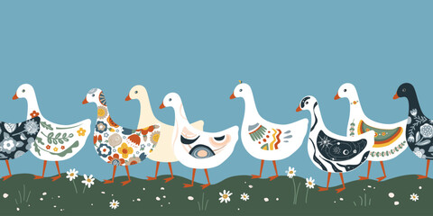A row of cute geese or ducks with various patterns on their plumage walking in the grass. Seamless pattern. © Toltemara