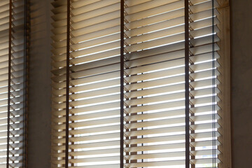 The window blinds are white and wooden