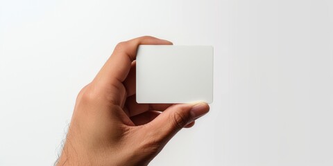 Obraz premium a hand holding a card, but the background behind it is white, and the overall color is white. 