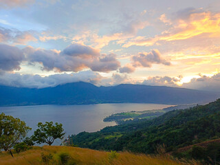 Beautiful sunset on Lake Singkarak from the top of the Aua Sarumpun peak, West Sumatra