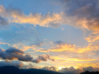 Beautiful sunset orange sky with clouds and blue sky