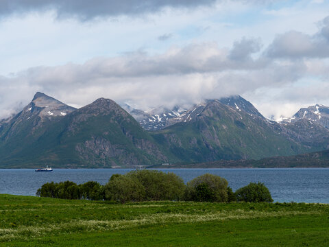 Cloudy mountains by the water