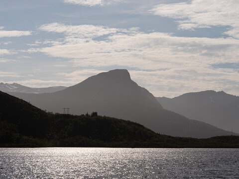 Sunlit water with mountains