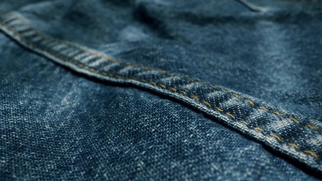 Blue textile jeans cloth texture close-up macro. Fashion fabric multicolor. Cotton casual clothes