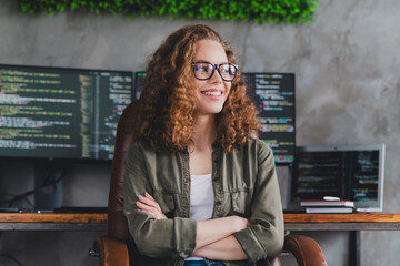 Photo of dreamy confident pretty woman software developer sitting armchair comfortable office...