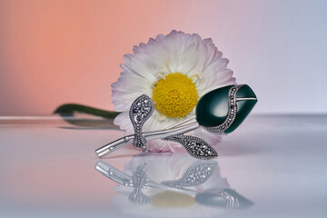 Elegant wedding and engagement rings with beautiful accessories and precious jewelry against a...