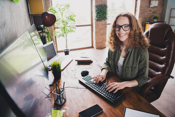 Photo of nice successful woman software developer sitting armchair comfortable workspace...