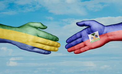 Haiti and Gabon country handshaking with flags, consensus concept international co-operation illustration