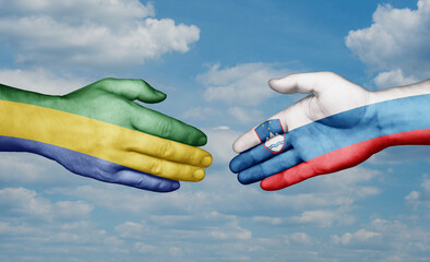 Slovenia and Gabon country handshaking with flags, consensus concept international co-operation illustration