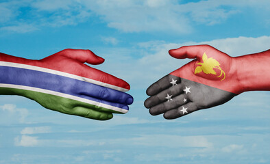 Papua New Guinea and Gambia country handshaking with flags, consensus concept international co-operation illustration