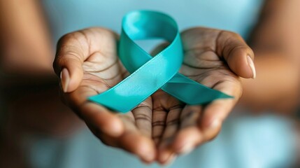 Teal ribbon on womans hand symbolizing awareness for ovarian cancer and PCOS. Concept Cancer Awareness, PCOS Awareness, Teal Ribbon, Health Advocacy