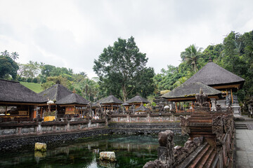 A tranquil courtyard in a Balinese temple, featuring traditional architecture and serene surroundings.