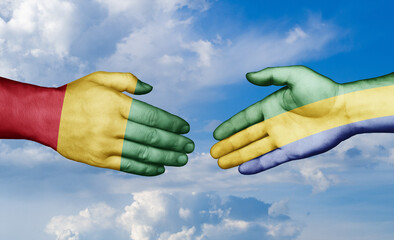 Gabon and  Guinea-Conakry country handshaking with flags, consensus concept international co-operation illustration