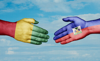 Haiti and  Guinea-Conakry country handshaking with flags, consensus concept international co-operation illustration