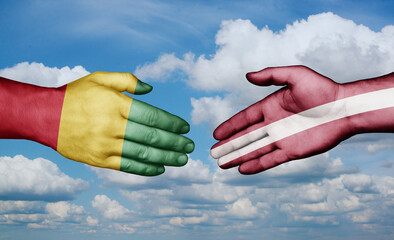 Latvia and  Guinea-Conakry country handshaking with flags, consensus concept international co-operation illustration