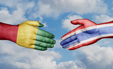 Kingdom of Thailand and  Guinea-Conakry country handshaking with flags, consensus concept international co-operation illustration