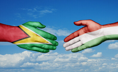 Hungary and Guyana country handshaking with flags, consensus concept international co-operation illustration