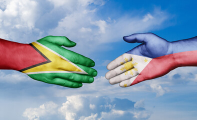 Philippines and Guyana country handshaking with flags, consensus concept international co-operation illustration