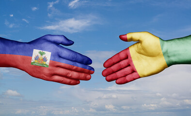 Republic of Guinea and Haiti country handshaking with flags, consensus concept international co-operation illustration