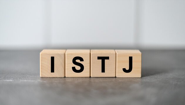 Wooden cubes with text ISTJ. Introversion, Sensing, Thinking, Judging. Personality type. Close-up.
