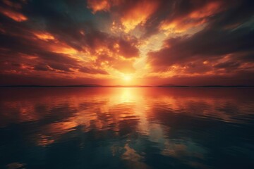 Obraz premium A breathtaking sunset over calm waters, showcasing vibrant colors that reflect beautifully on the surface, evoking serenity and peace.