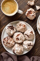 Chocolate meringue cookies and cup of coffee