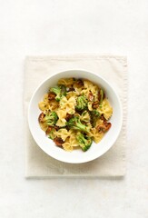 Farfalle pasta with roasted broccoli and mushrooms in bowl