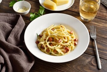 Carbonara pasta, spaghetti with crisp pancetta and black pepper