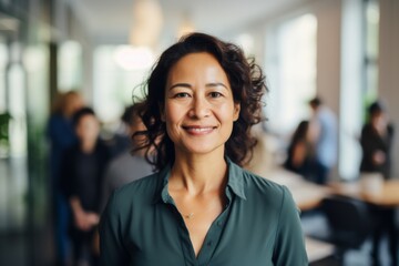 Portrait of a confident middle aged businesswoman in office