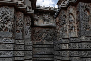 Intricate carvings of Hindu deities and also depict scenes from Hindu epics in the Hindu temple of...