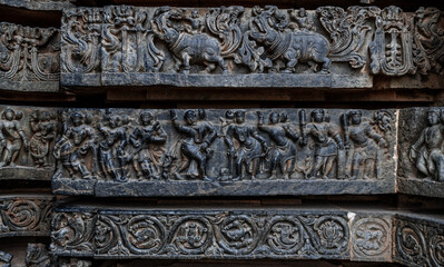 Intricate carvings of Hindu deities and also depict scenes from Hindu epics in the Hindu temple of Halebidu. India.