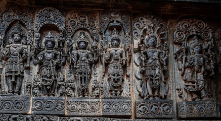 Intricate carvings of Hindu deities and also depict scenes from Hindu epics in the Hindu temple of Halebidu. India.