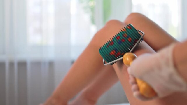 Foot massage with a roller with needles.