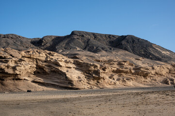 Ventifact rock formations caused by wind at La Pared Beach, Fuerteventura