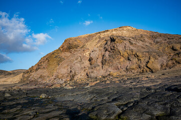 Ventifact rock formations caused by wind at La Pared Beach, Fuerteventura
