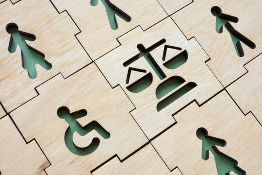 Equal Rights and inclusion. Puzzle with disable person and law sign.