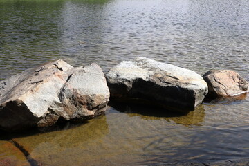 Rock or stone formation in the water. Close up photo. Baltic sea, Fogdö, Stockholm, Sweden.