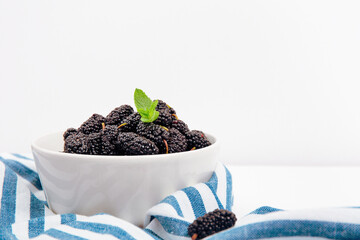 Fresh Blackberries In White Bowl With Mint