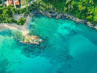 aerial top view above small island in front of Yanui beach in low tide. Sand dunes in the separate sea. Sandbars form in the Separated Sea when the water level goes down. green sea white sand beach.